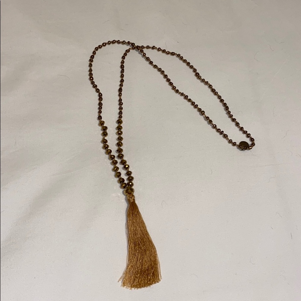 Gold necklace with tassel